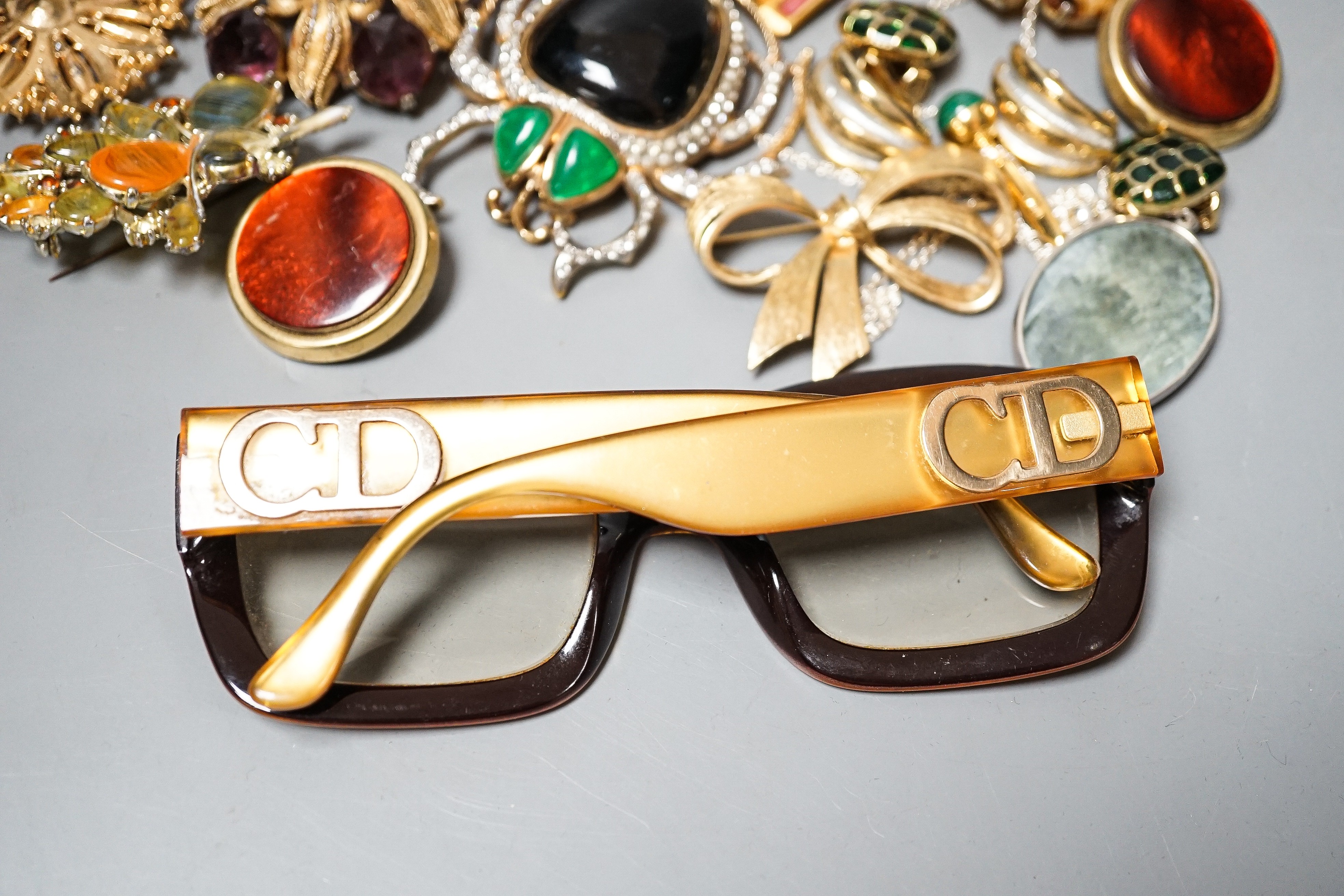 A mixed lot of costume jewellery including Christian Lacroix, scarab brooch stamped Valentino, Dior glasses etc.